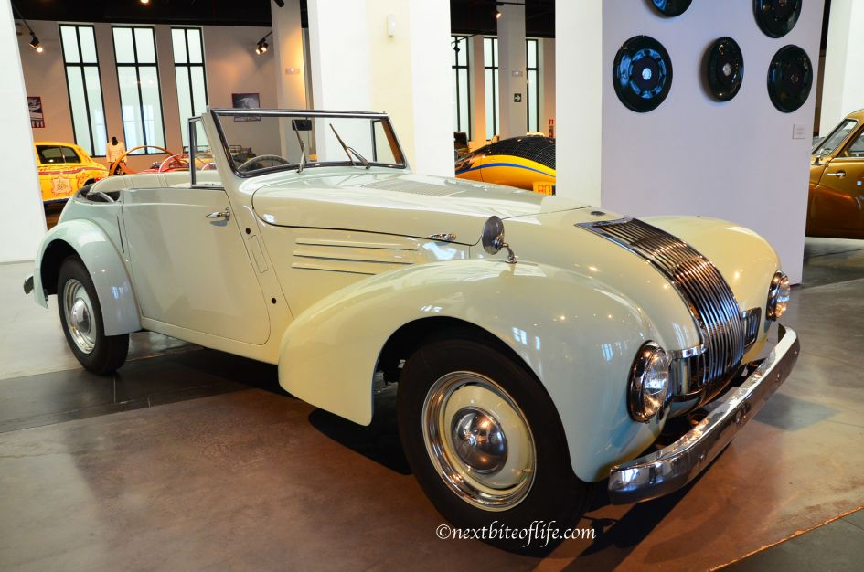 classic cream colored buggy at auto museum malaga