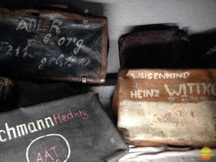 Luggage of camp prisoners at Auschwitz with visible names on them still in the monumental Auschwitz krakow post