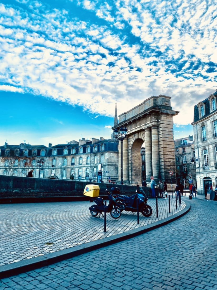 Postcard from beautiful Bordeaux France gate with city view 