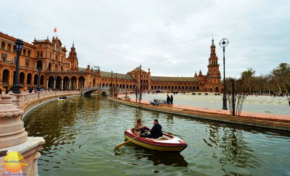  canoe ride in seville with plaza behind