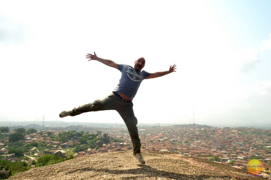 Olumo Rock Abeokuta. Remarkable Climb And Awesome Views 9 white man jumping for joy at the top of Olumo Rock Nigeria