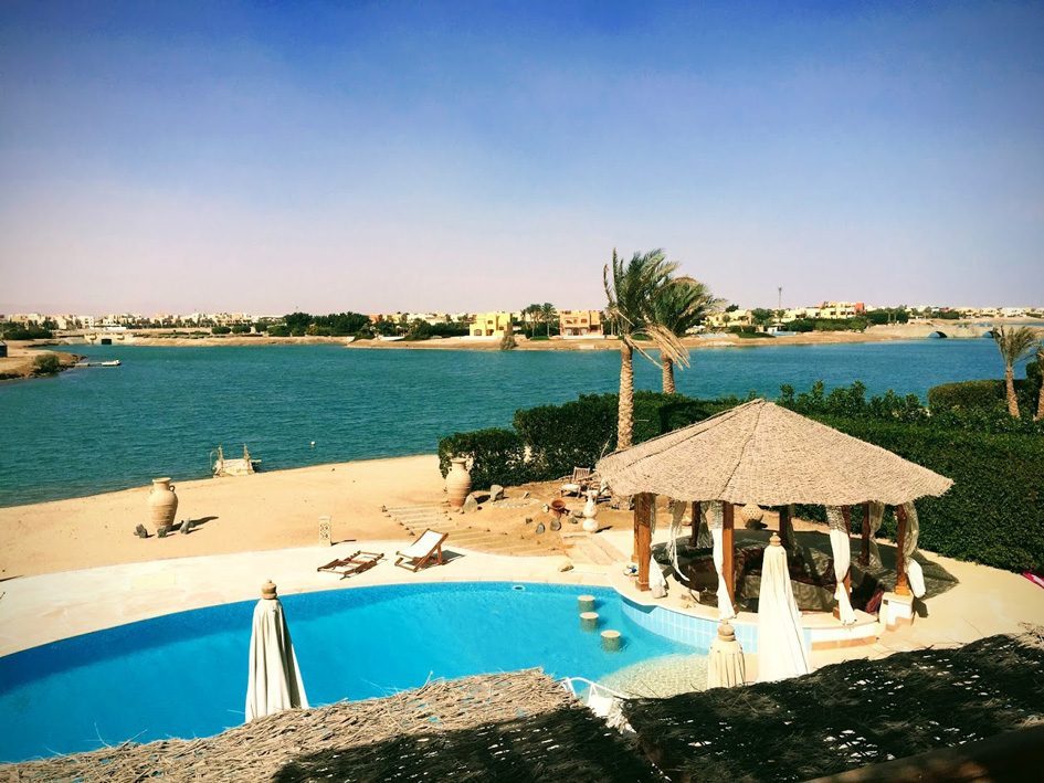 Lockdown In Las Vegas - Episode 2 Podcast 4 cabana and pool view from villa in El Gouna with blue lake behind and beach.