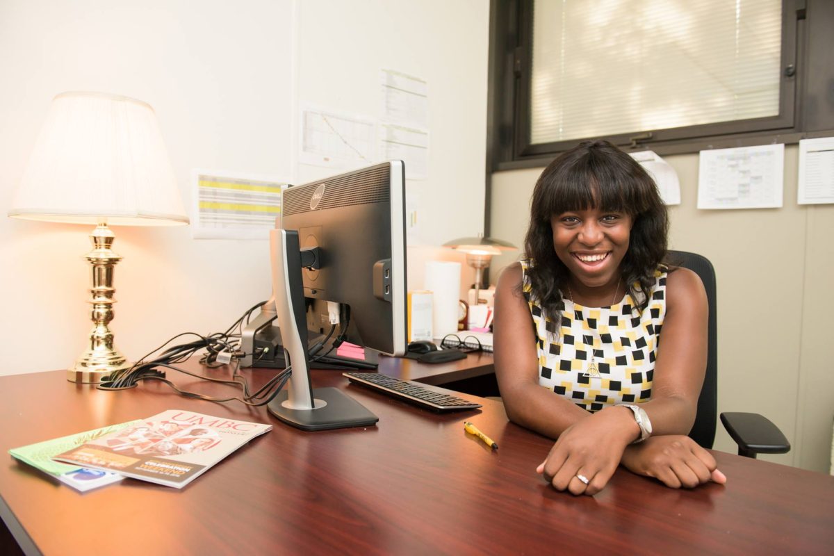 AMERICAN EXPAT IN LONDON CHRISTINE OSAZUWA 3 Christine at her desk with computer, an American in London