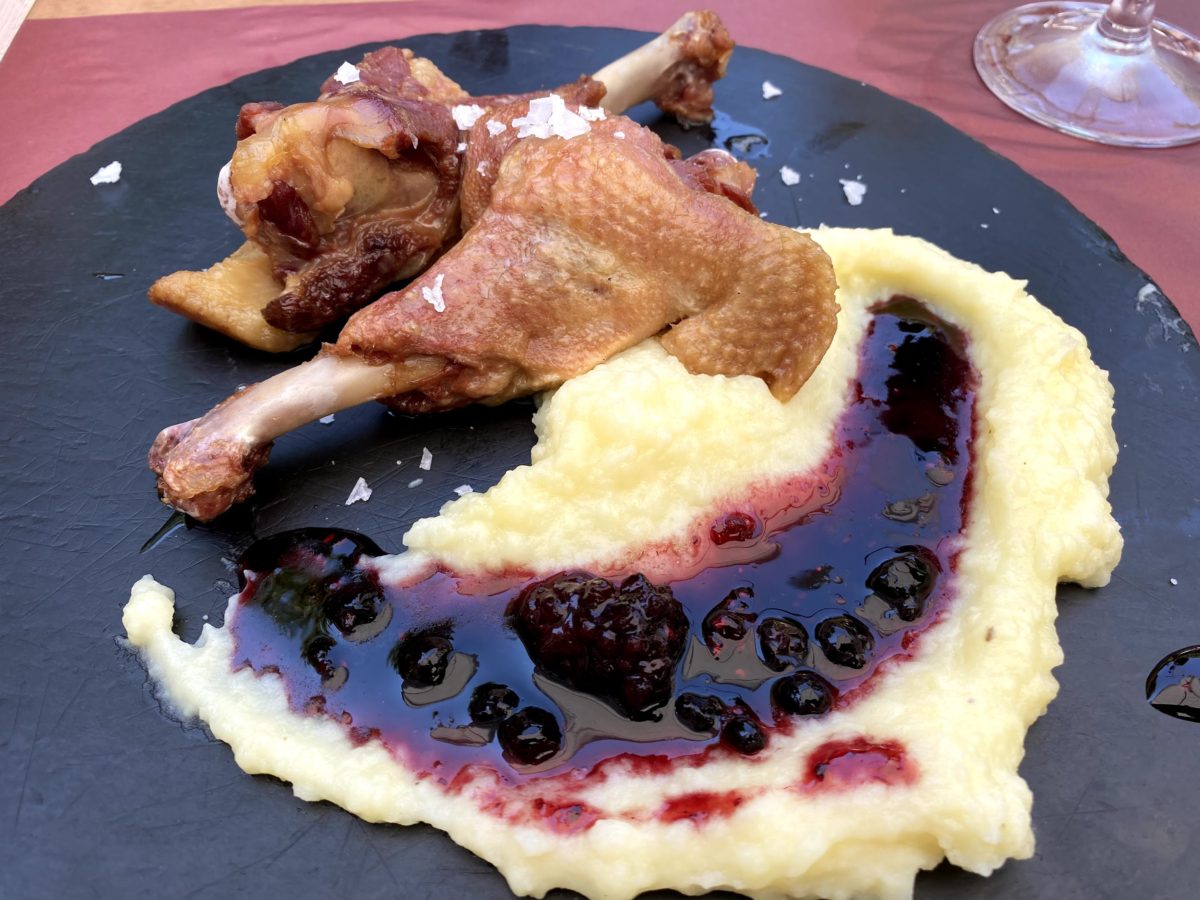 duck with mashed poptatoes on black slate. One of the things to eat in Tarragona Spain destination guide.