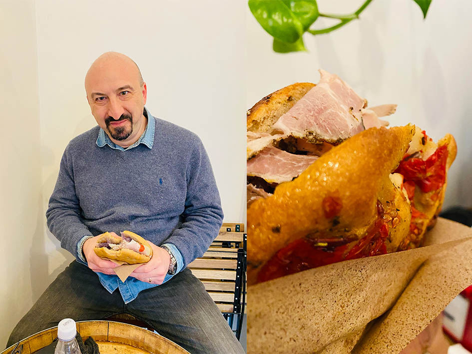 Man holding sandwich at Mollica in Torino - 5 fantastic reasons to visit torino